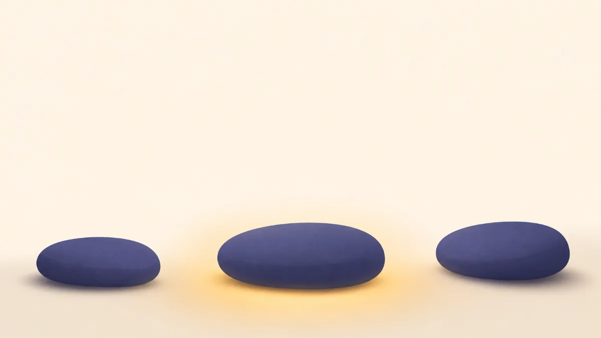 A flat illustration of three rounded stepping stones forming a gentle path, a soft gold glow settling around the middle stone